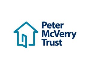 Peter McVerry Trust logo: teal house outline with an open door, next to bold dark blue 'Peter McVerry Trust' text.